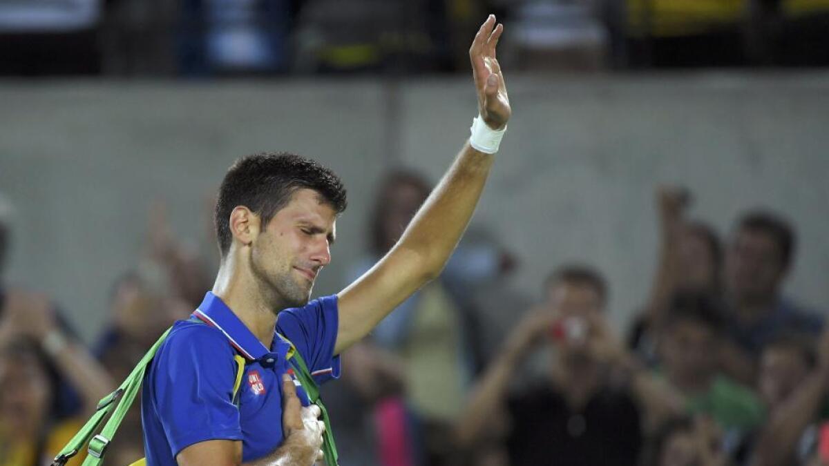 Novak Djokovic of Serbia reacts after losing his match against Juan Martin Del Potro of Argentina and being knocked out of Rio.  Reuters