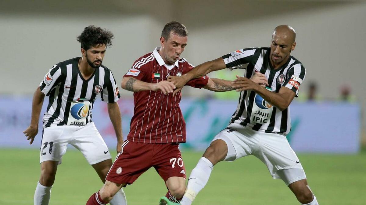 Al Wahda and Al Jazira (striped jersey) seen during a previous clash last season.