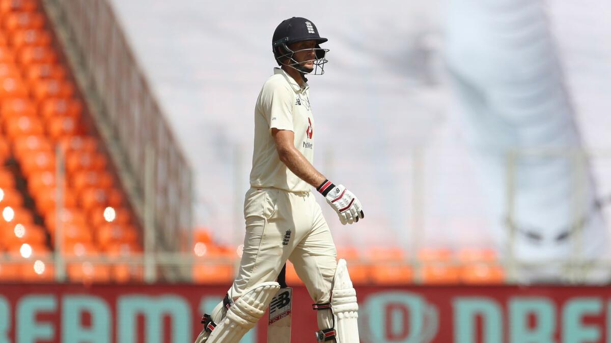 England's captain Joe Root walks off the field after being dismissed by India's Ravichandran Ashwin during the third day of fourth Test. — AP