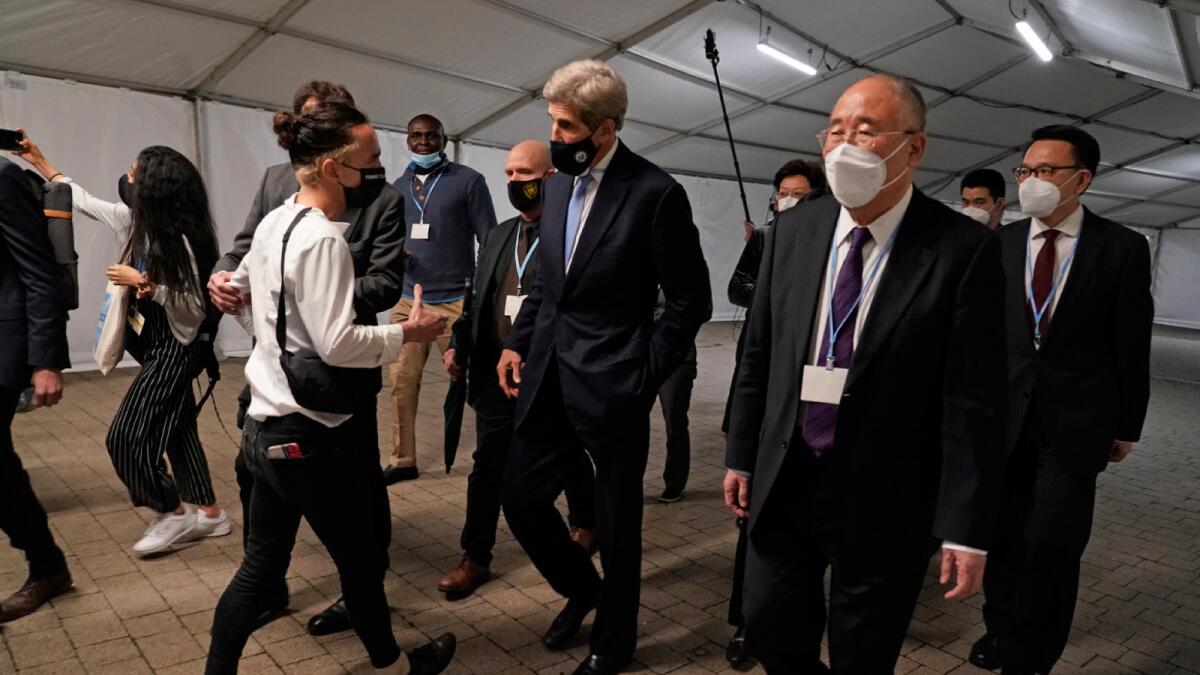 China's chief negotiator Xie Zhenhua walks with John Kerry, US Special Presidential Envoy for Climate at the COP26 UN Climate Summit in Glasgow, Scotland. – AP