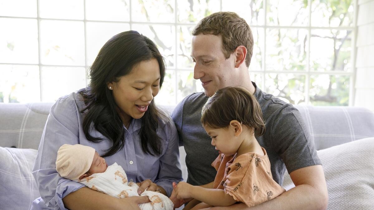 This photo provided by Facebook, shows Facebook CEO Mark Zuckerberg with his wife, Priscilla Chan, and their new baby daughter August, left, and her sister Maxima, right, in Palo Alto, California.-AP