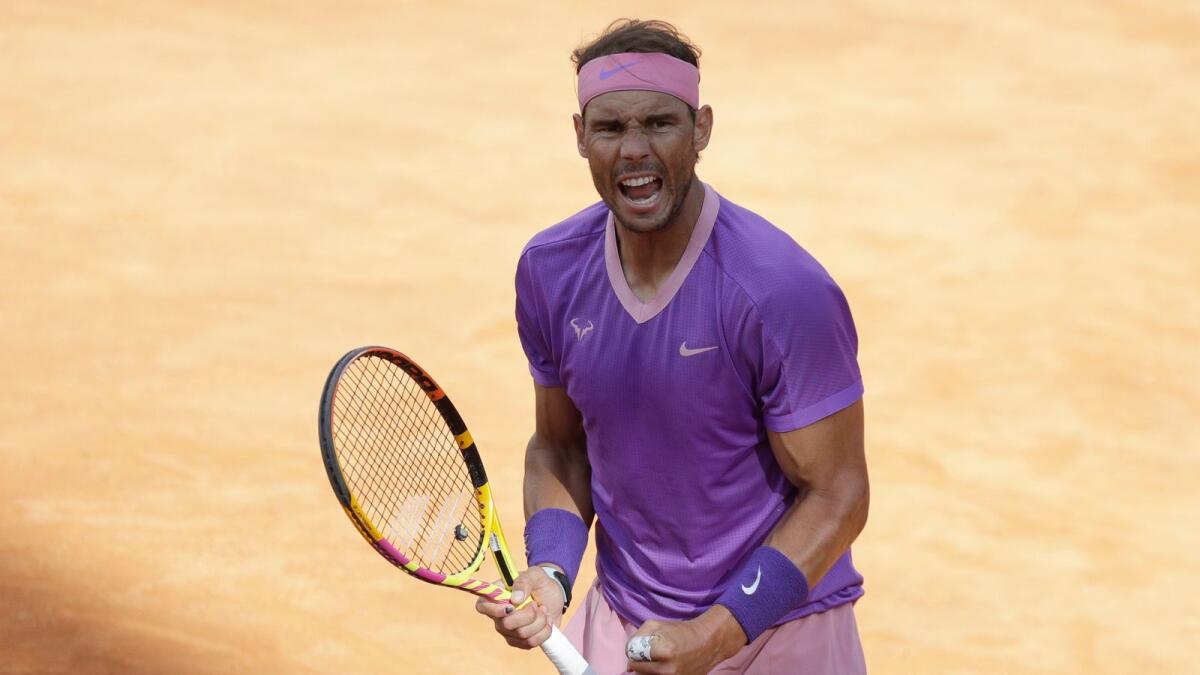 Spain's Rafael Nadal celebrates after winning his semifinal match against United States' Reiley Opelka. — AP