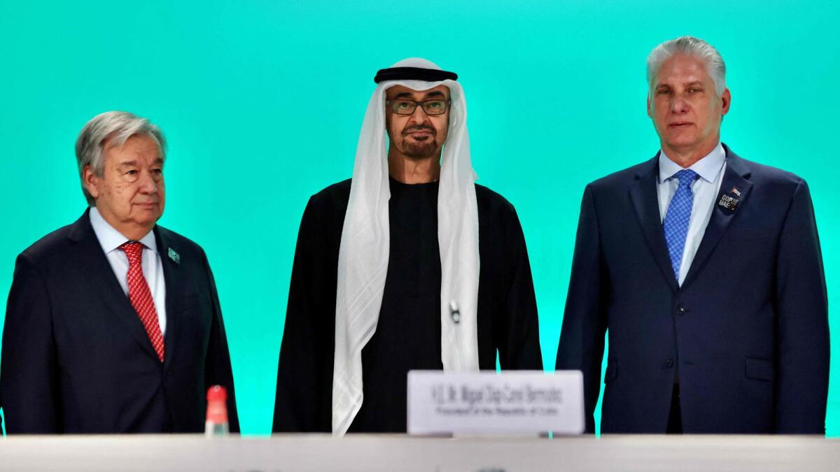 Sheikh Mohamed bin Zayed Al Nahyan and Antonio Guterres with Cuban President Miguel Diaz Canel duing a press conference at the COP28 United Nations climate summit in Dubai. - AFP
