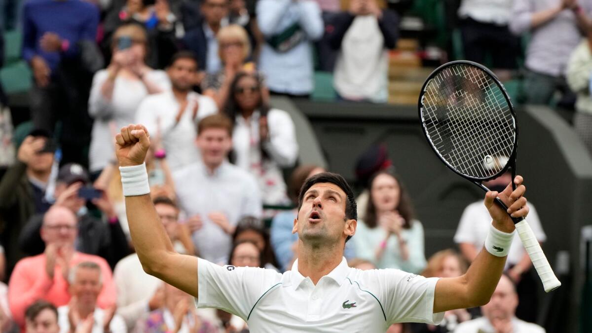 Serbia's Novak Djokovic celebrates winning the men's singles match against Britain's Jack Draper on day one of the Wimbledon Tennis Championships. — AP