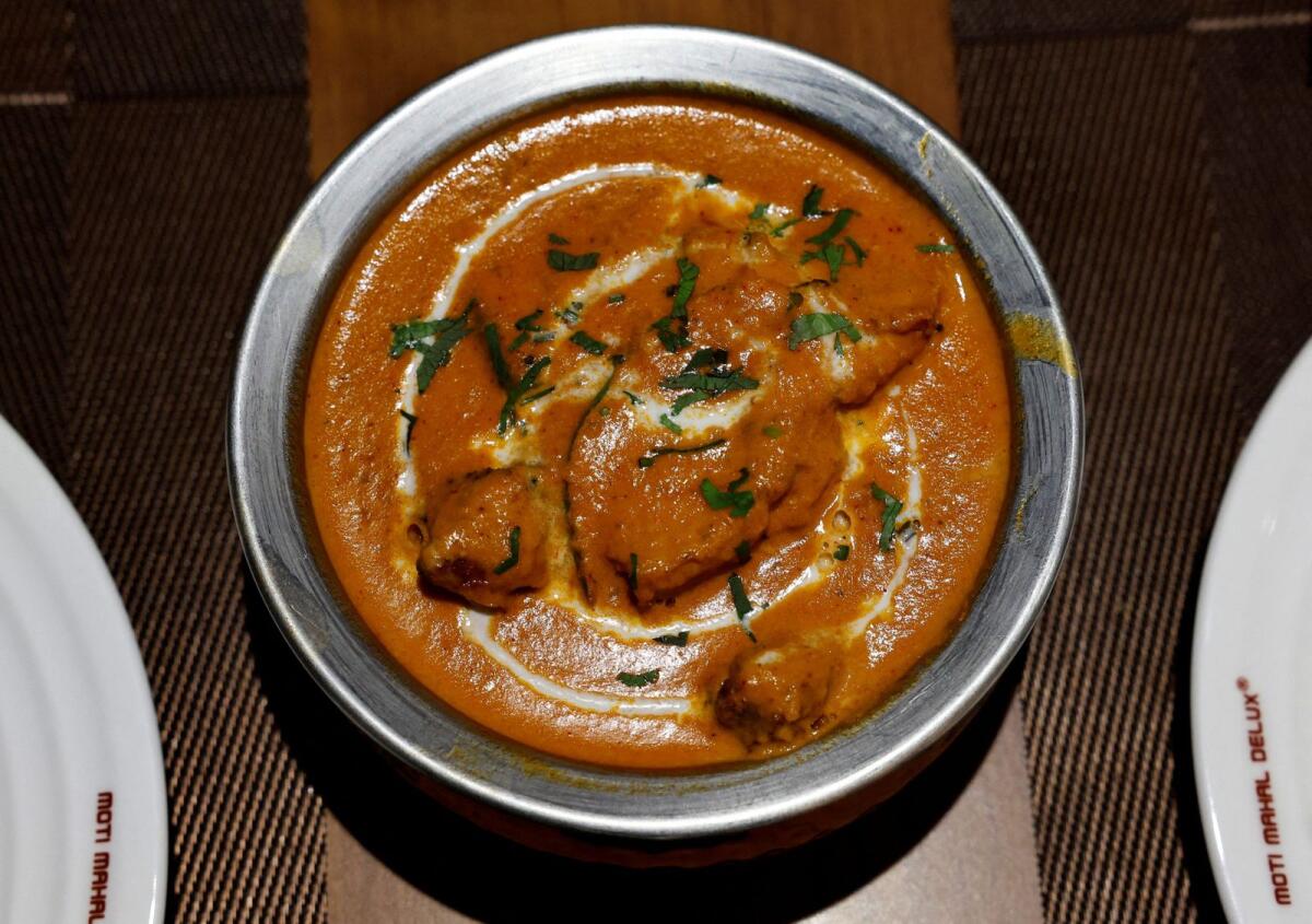 A freshly prepared butter chicken dish is placed on a table inside the Moti Mahal Delux restaurant in New Delhi, India, on January 23, 2024. — Reuter
