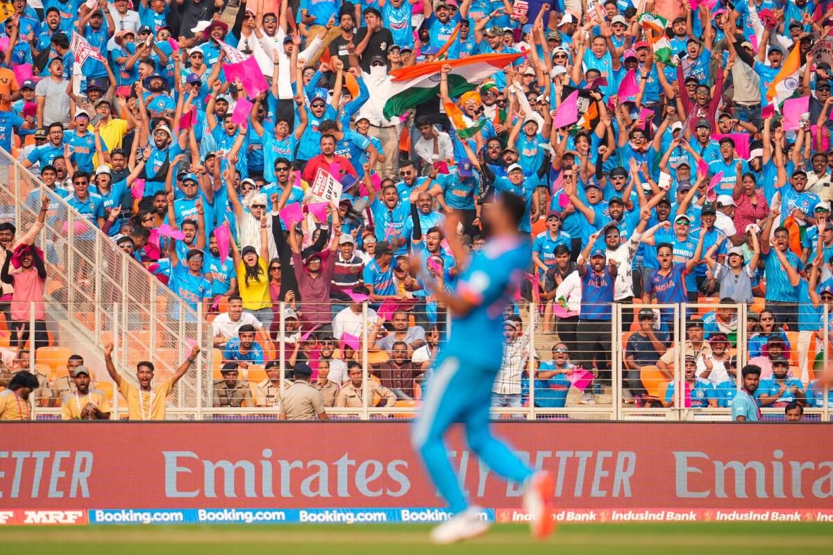 Fans celebrate after India's Mohammed Siraj dismisses Pakistan's Babar Azam. — PTI