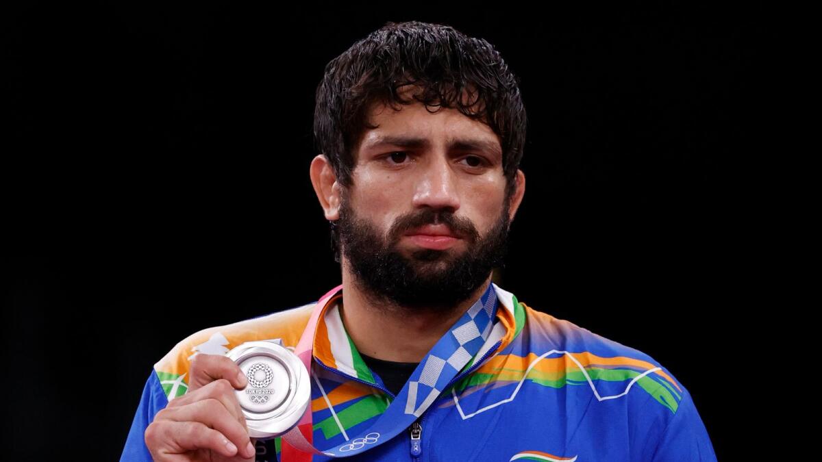 India's Ravi Kumar Dahiya poses with his silver medal on the podium. (AFP)