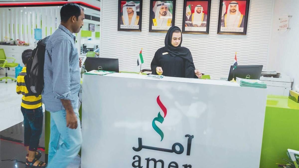A staff assisting an applicant at the Amer Centre, a one-stop office for residence visa transactions, in Muhaisnah, Dubai. — Photo by Neeraj Mural