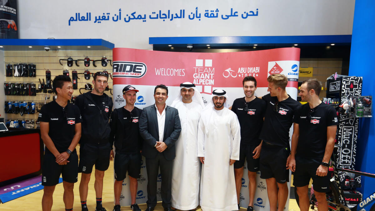 Aref Ahmad Al Awani, general secretary, ADSC; Osama Ahmed Al Shafar, president, Emirate Cycling Federation; and members of the Team Giant-Alpecin in Abu Dhabi. — Photo by Nezar Balout