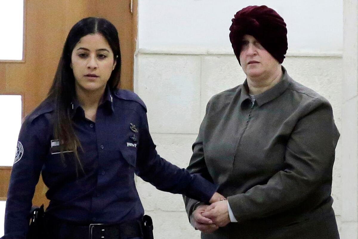 Israeli-born Australian Malka Leifer, right, is brought to a courtroom in Jerusalem on Feb. 27, 2018. — AP file