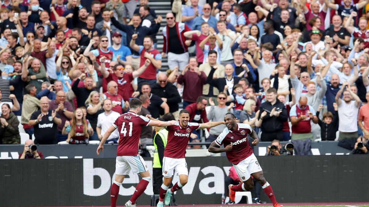 West Ham United's Michail Antonio celebrates scoring their second goal with Declan Rice and Pablo Fornals. — Reuters