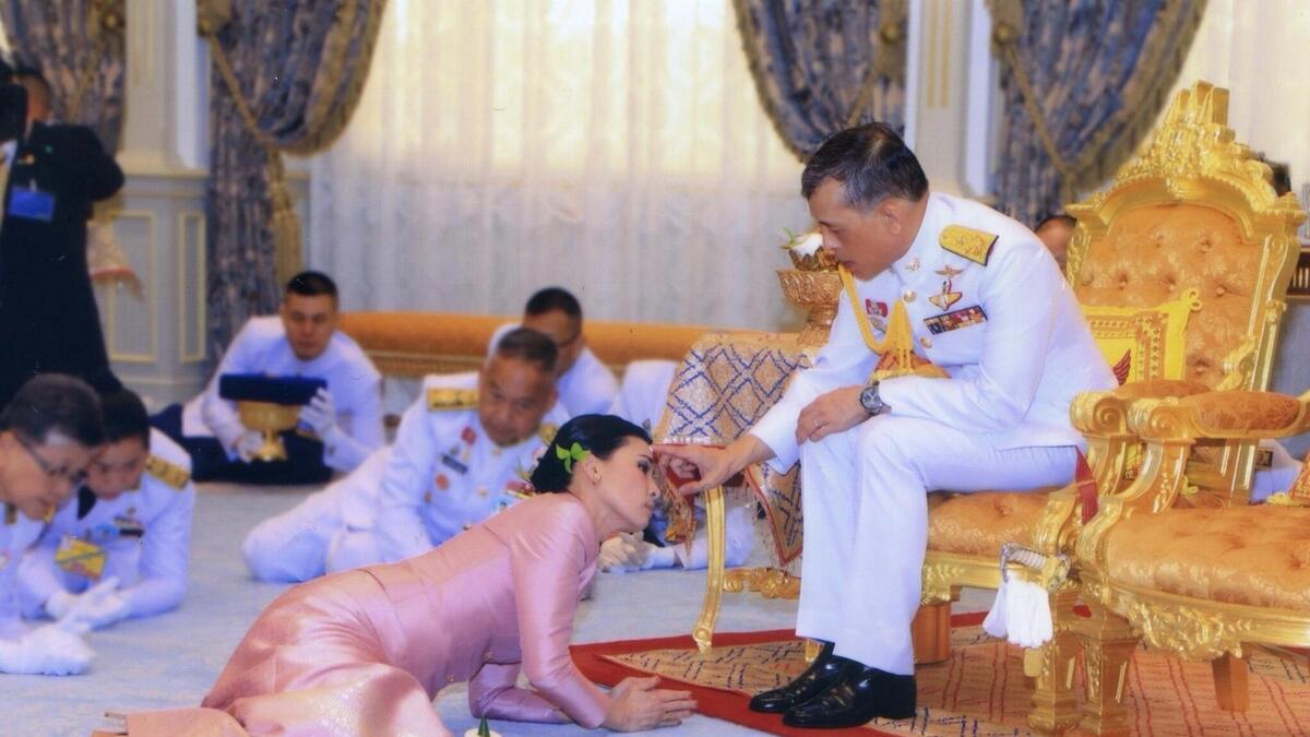 Thailands King marries bodyguard, names her queen
