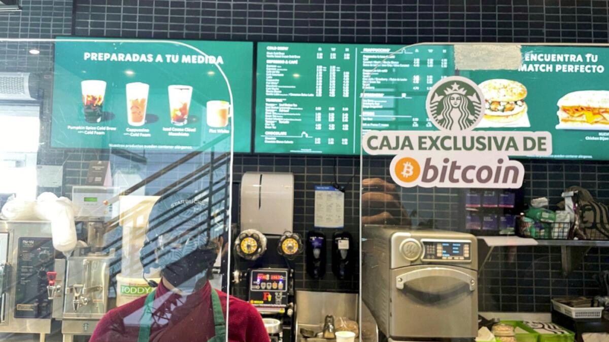 A Starbucks store sign reads ‘Exclusive Bitcoin register’. El Salvador became the first country in the world to accept the cryptocurrency as a payment method. — Reuters