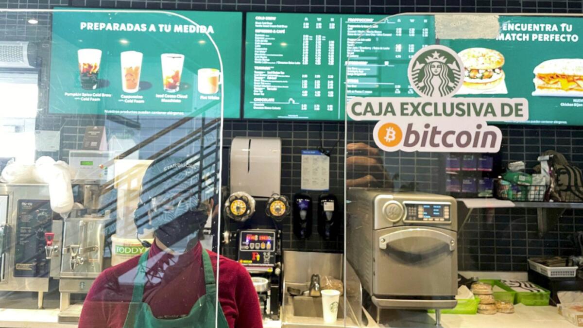 A Starbucks store sign reads ‘Exclusive Bitcoin register’. El Salvador became the first country in the world to accept the cryptocurrency as a payment method. — Reuters