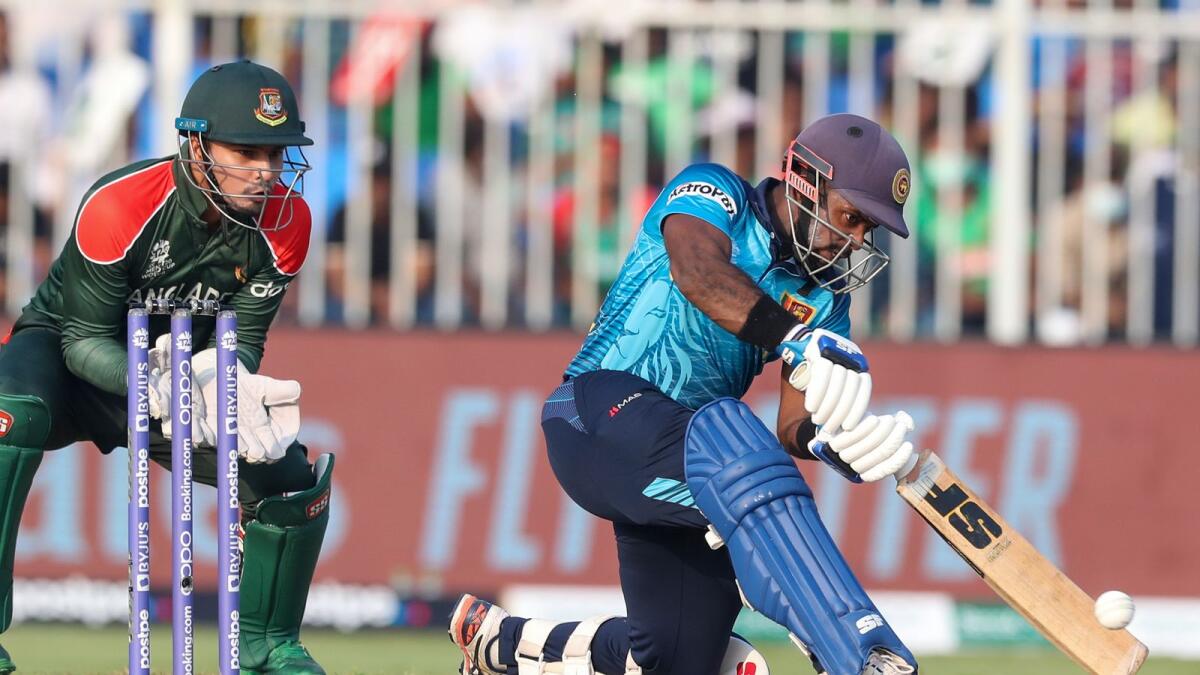 Sri Lanka’s Charith Asalanka plays a shot against Bangladesh in Sharjah on Sunday. — AP