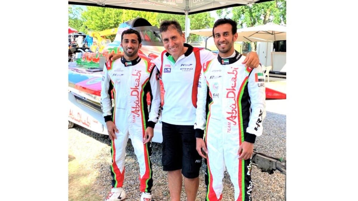 Rashed Al Qemzi and Mansoor Al Mansoori with team manager Guido Cappellini. (Supplied photo)