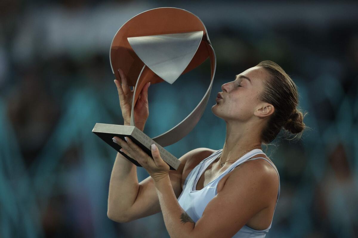 Belarus' Aryna Sabalenka kisses the trophy. — AFP