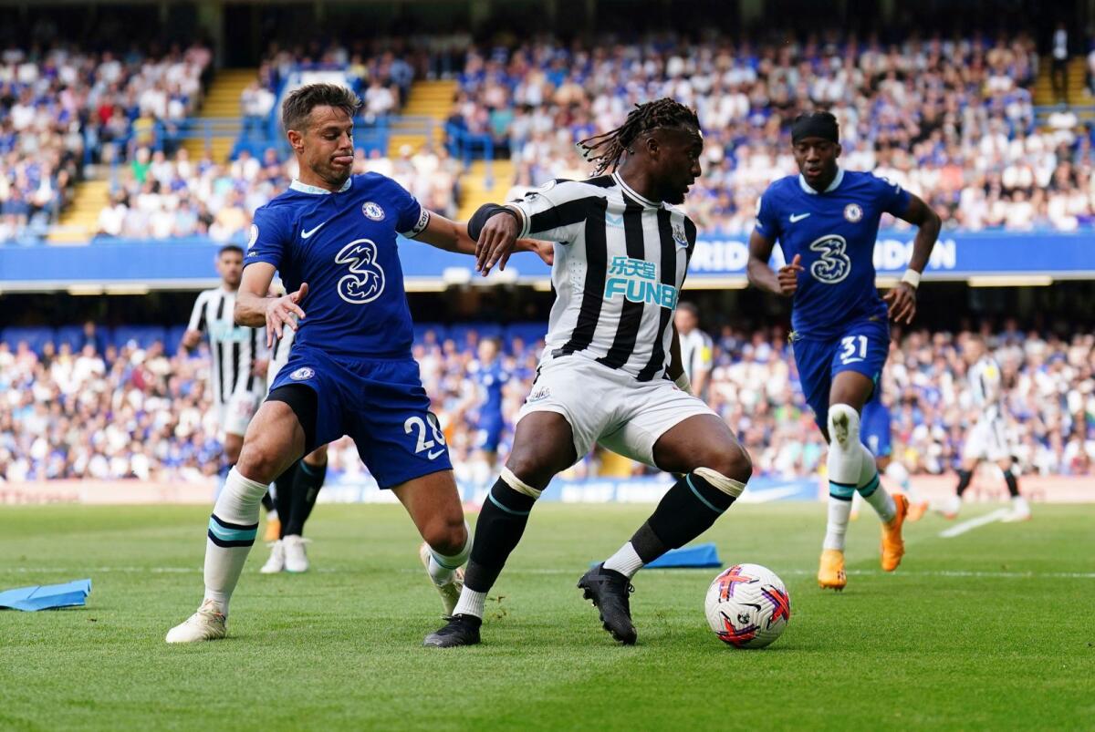 Newcastle United's Allan Saint-Maximin (C) holds off Chelsea's Cesar Azpilicueta, during a English Premier League match. - AP