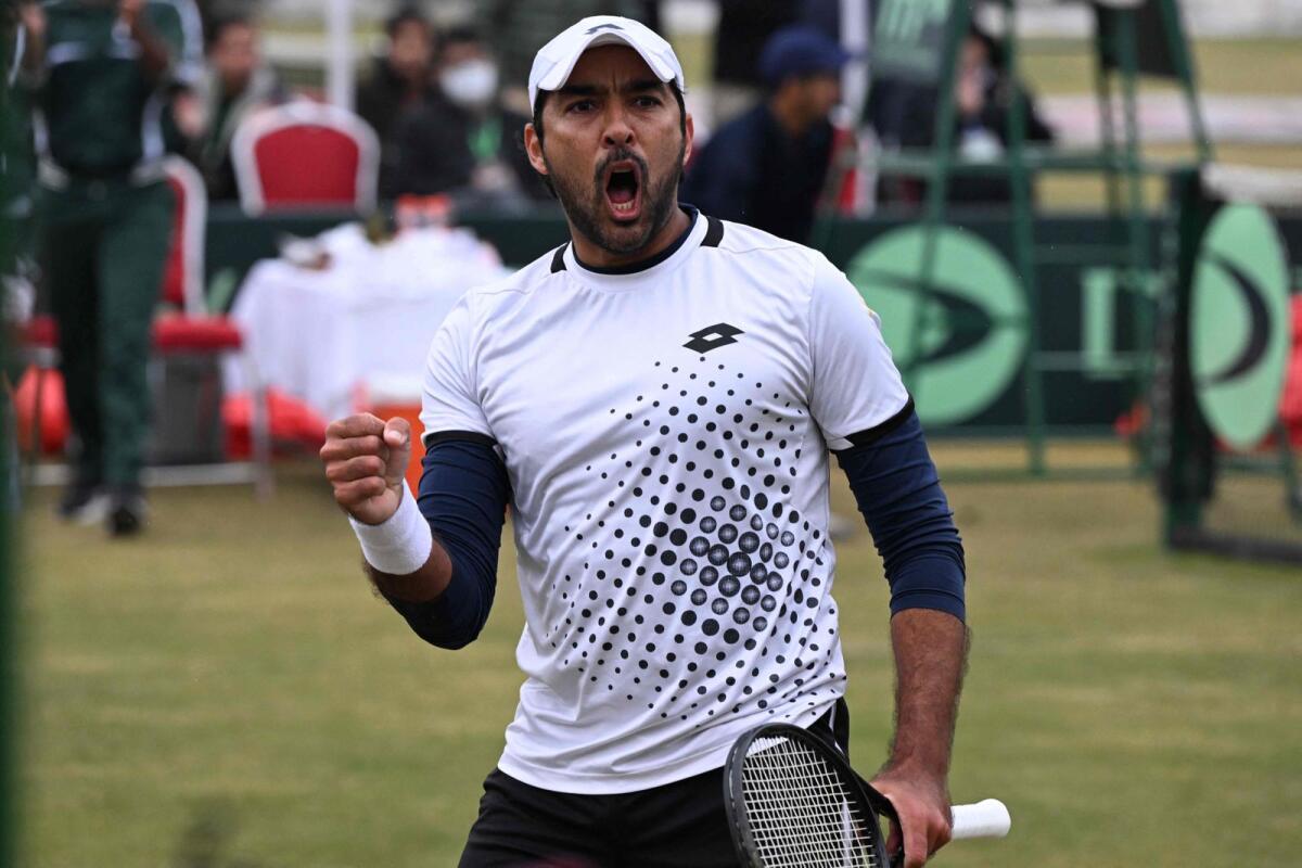 Aisam-ul-Haq Qureshi celebrates after scoring a point against India's Ramkumar Ramanathan during their singles match of the Davis Cup World Group-1 play-off between Pakistan and India in Islamabad on February 3, 2024. — AFP