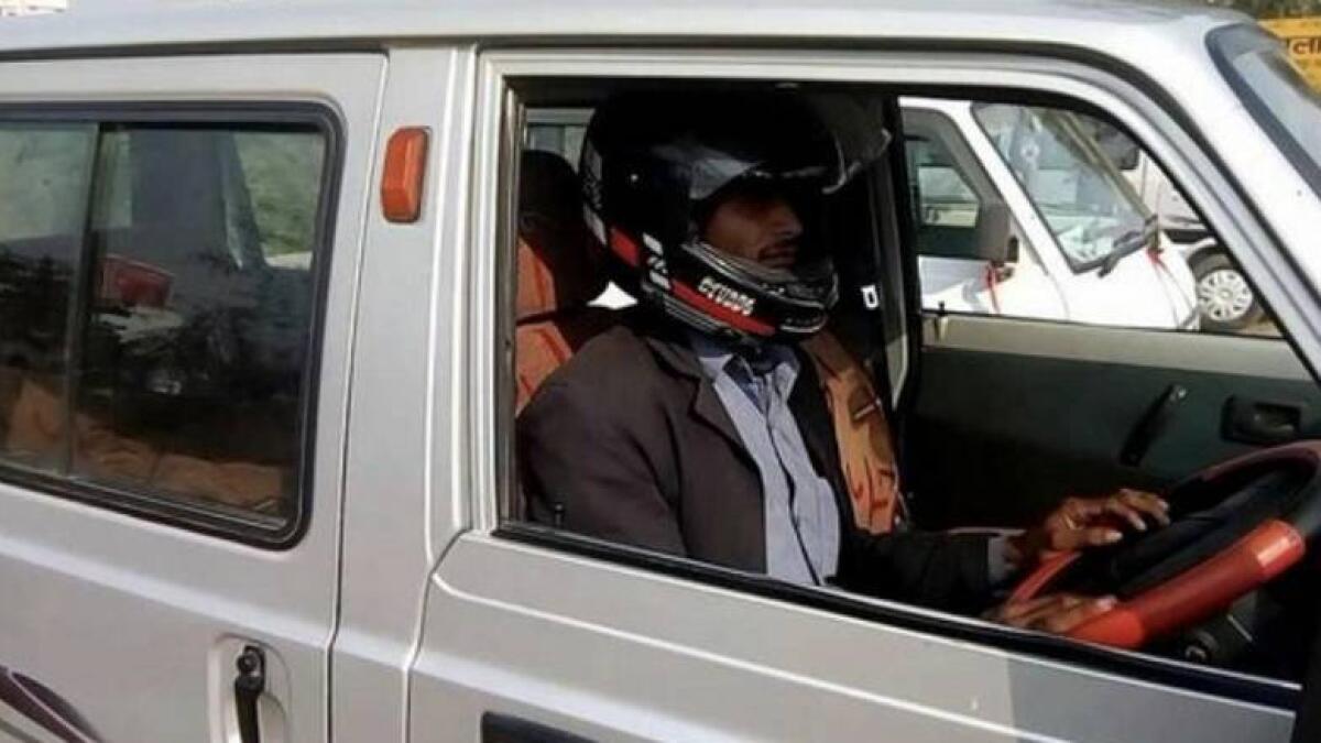 motorist fined, car driver not wearing helmet, india, offbeat news