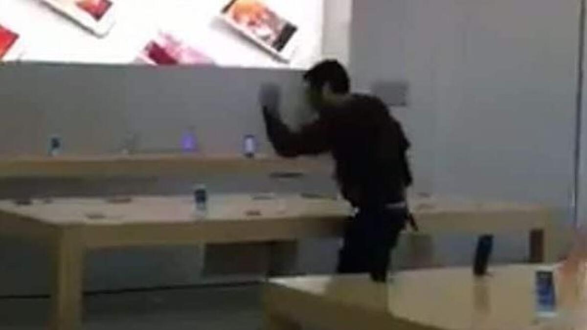 WATCH: French man walks into Apple store, smashes iPhones