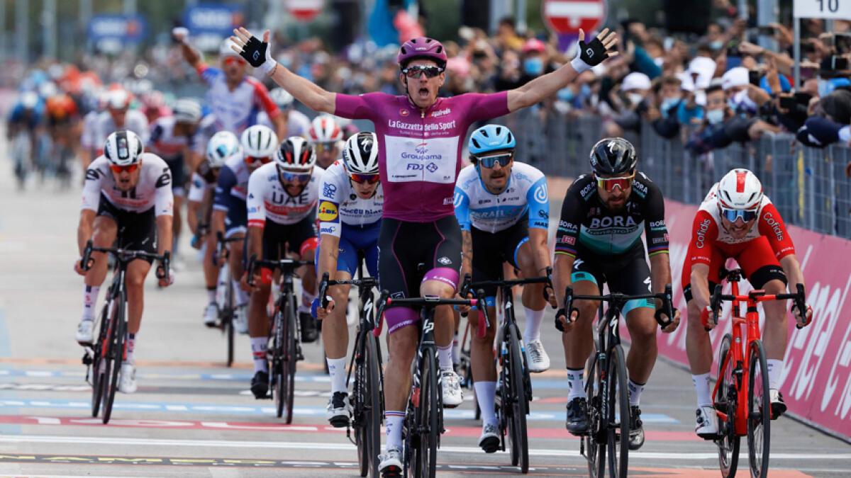Team Groupama-FDJ rider Arnaud Demare celebrates after winning the 11th stage of the Giro d'Italia 2020 cycling race. - AFP