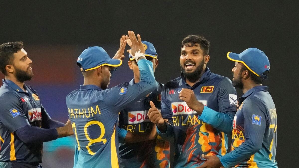 Sri Lanka's Wanindu Hasaranga de Silva (second right) celebrates with his teammates after taking the wicket of Australia's Alex Carey. (AP)