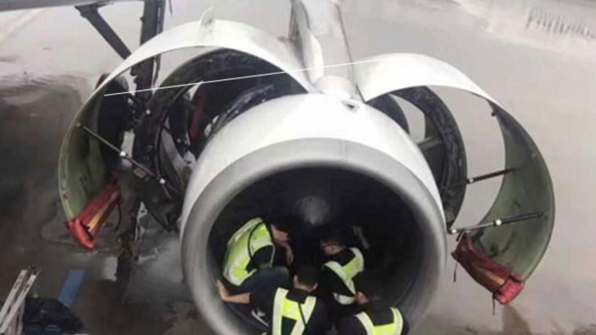 Superstitious passenger throws coins into plane engine for luck