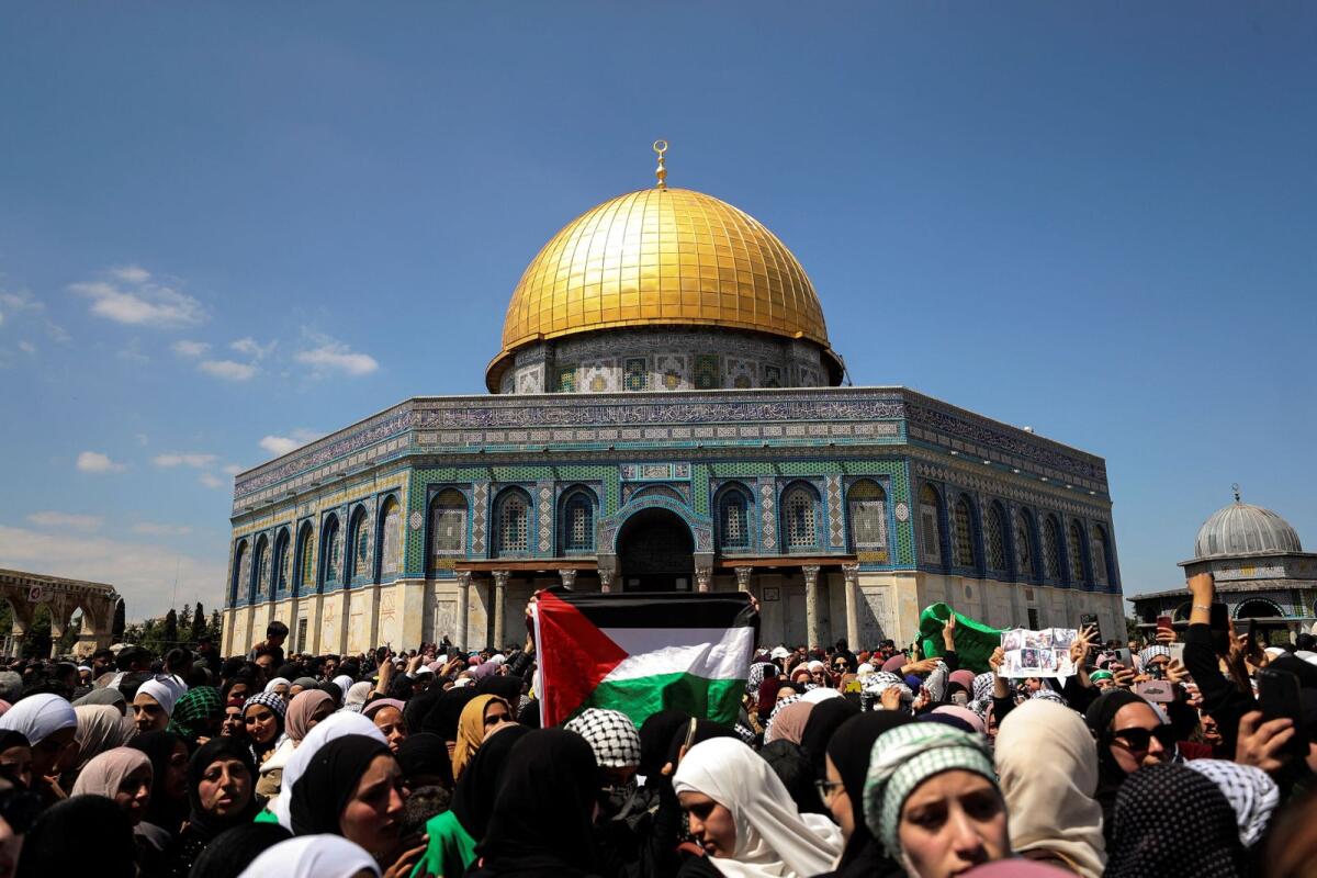 Palestinians gather near the Dome of the Rock on the fourth Friday of the holy month of Ramadan on Al Aqsa compound in Jerusalem's Old City on Friday.  — Reuters
