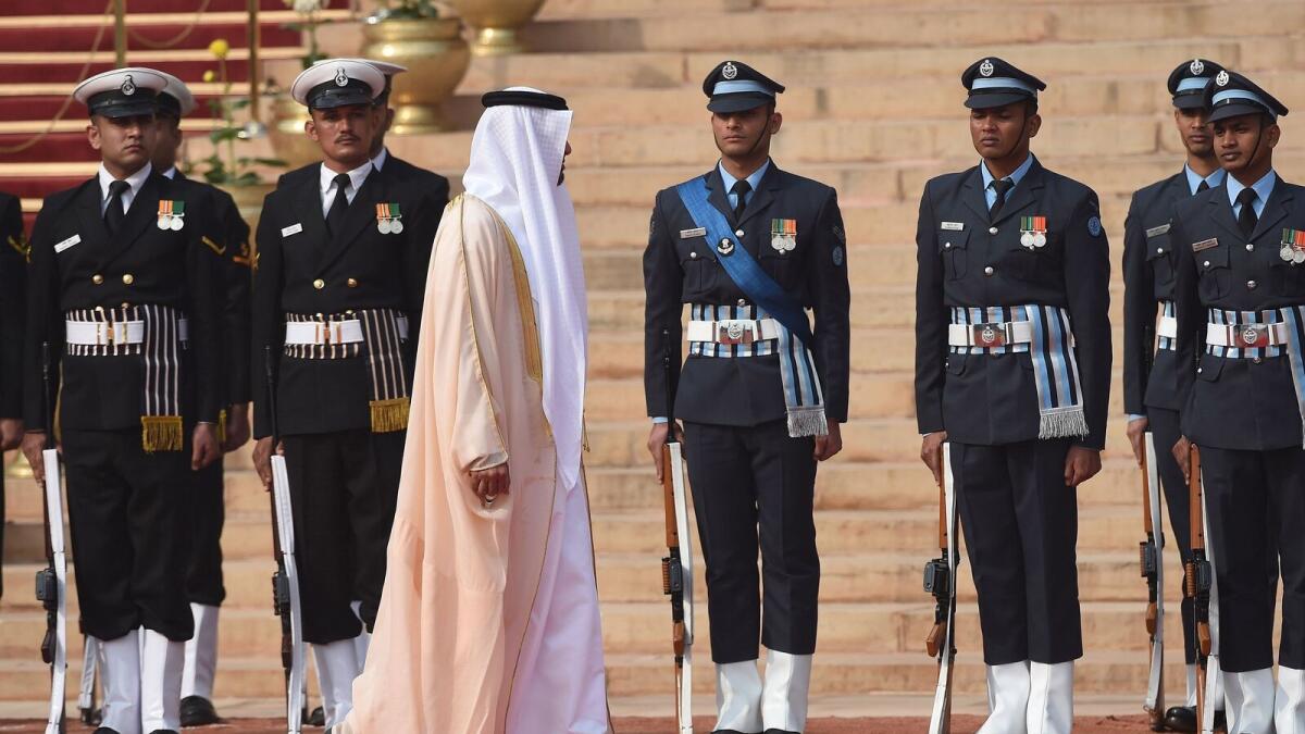 His Highness Shaikh Mohammed bin Zayed Al Nahyan, Crown Prince of Abu Dhabi and Deputy Supreme Commander of the UAE Armed Forces, inspects a guard of honour during a ceremonial reception at the presidential palace in New Delhi on February 11, 2016.