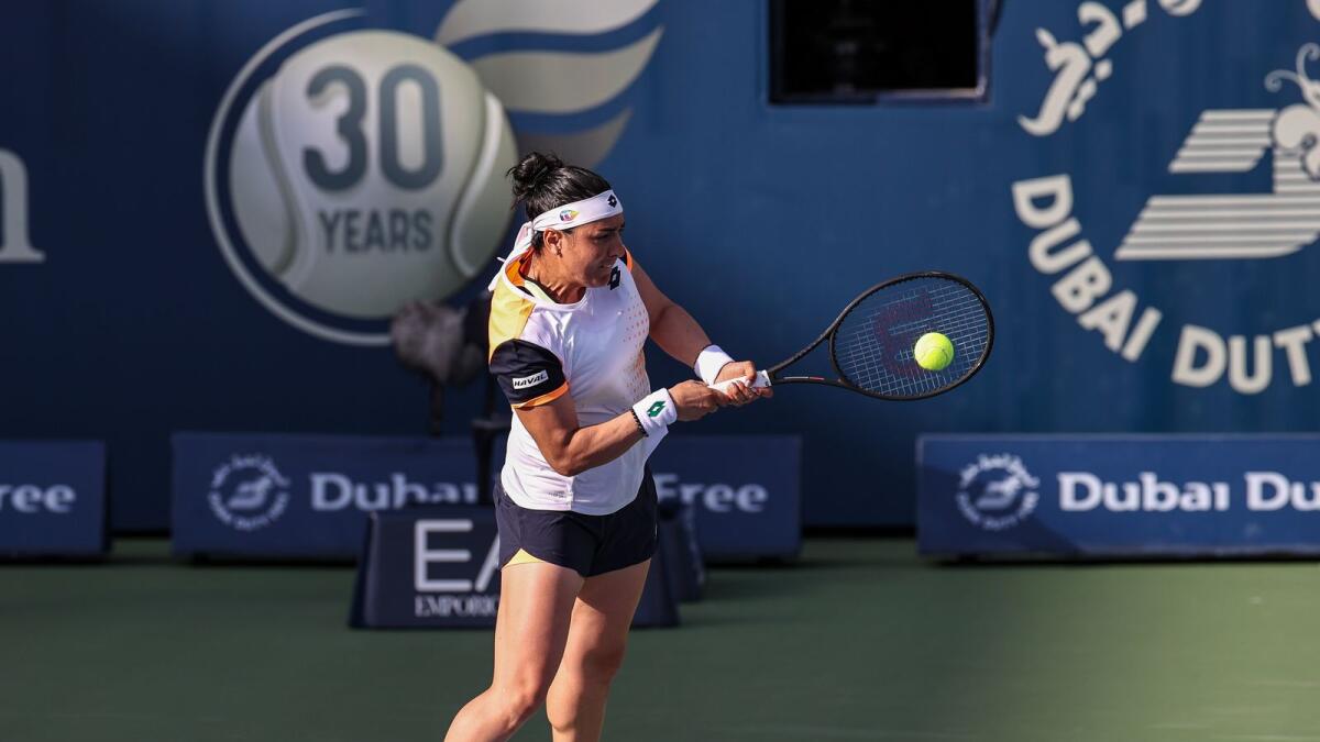 Tunisia's Ons Jabeur plays a backhand against Russia's Vera Zvonareva in the first round of WTA Dubai Duty Free Tennis Championships on Tuesday. — Supplied photo