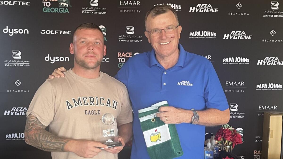Joseph Longstaff (left) winner of Division A in the qualifying round at Al Zorah Golf Club with Race to Georgia Tournament Organiser Keith Watson. - |Supplied photo