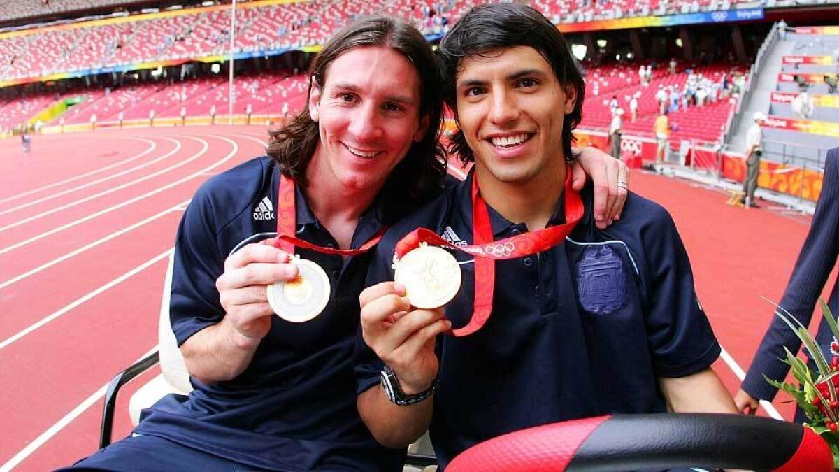 Messi and Argentina team-mate Sergio Aguero pose with their gold medals after helping their side to victory at the 2008 Olympics.