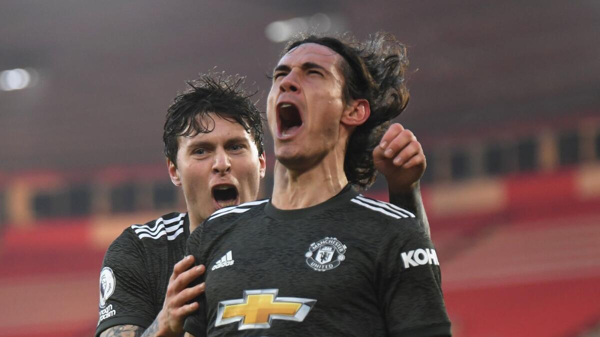 Manchester United's Edinson Cavani celebrates scoring a goal with Victor Lindelof. (Reuters)