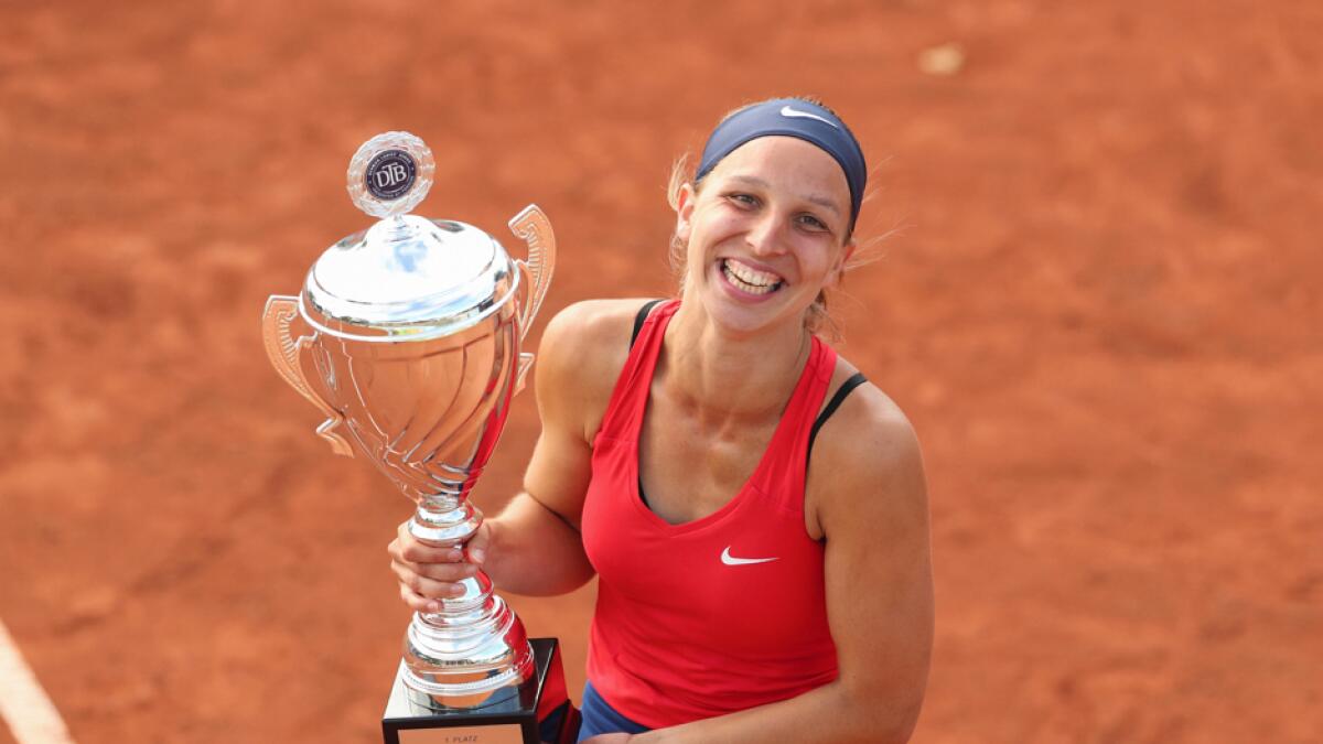 Tamara Korpatsch poses with the cup following the award ceremony, after she won the DTB German Pro Series women singles tournament in Versmold, Germany, on Sunday, July 26, 2020. Photo: AP