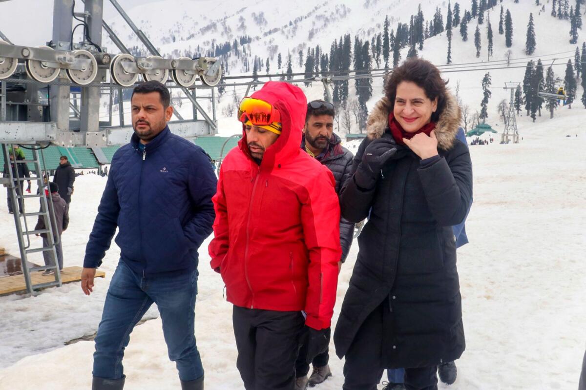 Congress General Secretary Priyanka Gandhi with her husband Robert Vadra at snow-covered Gulmarg on Sunday. — PTI