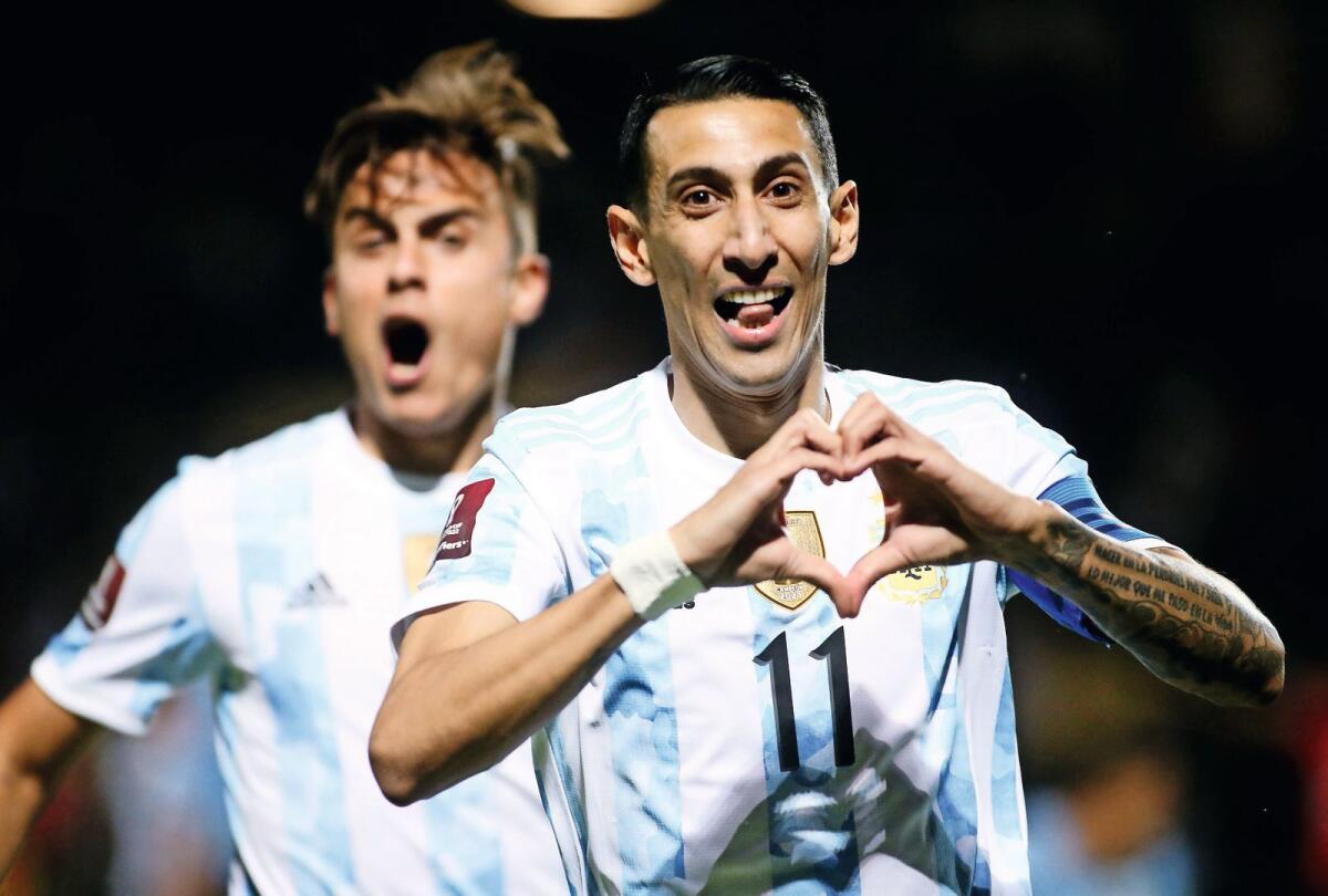 Argentina's Angel Di Maria (right) and Paulo Dybala. — Reuters file