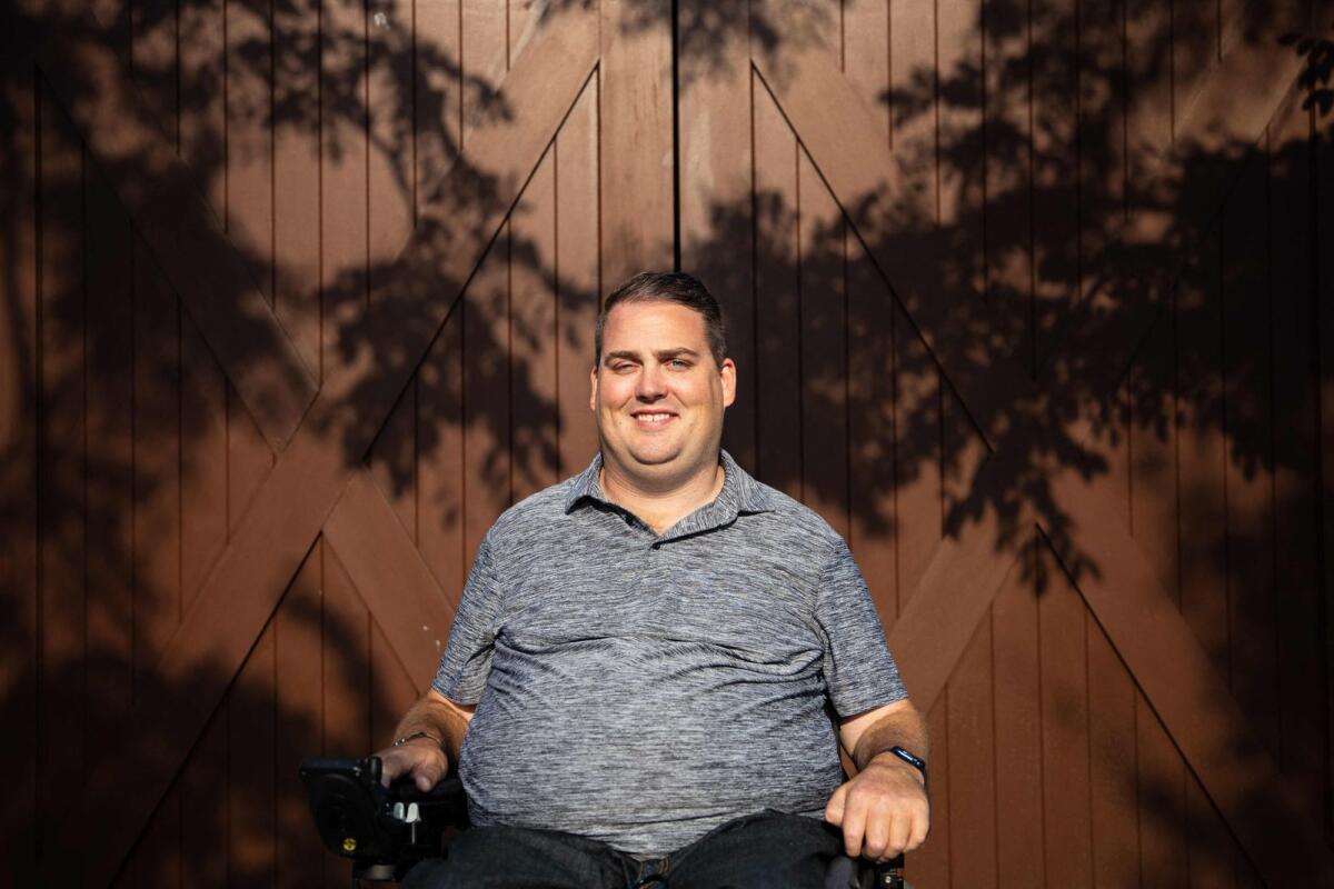 Ian Burkhart poses for a portrait in Columbus, Ohio, on August 2, 2023. Burkhart looked down at his hand and imagined closing it. To his amazement, it closed. That moment, back in 2014, was the first time in history that a paralysed person had regained the ability to move their arm using just their thoughts -- with a little help from a device implanted in their brain.-- AFP