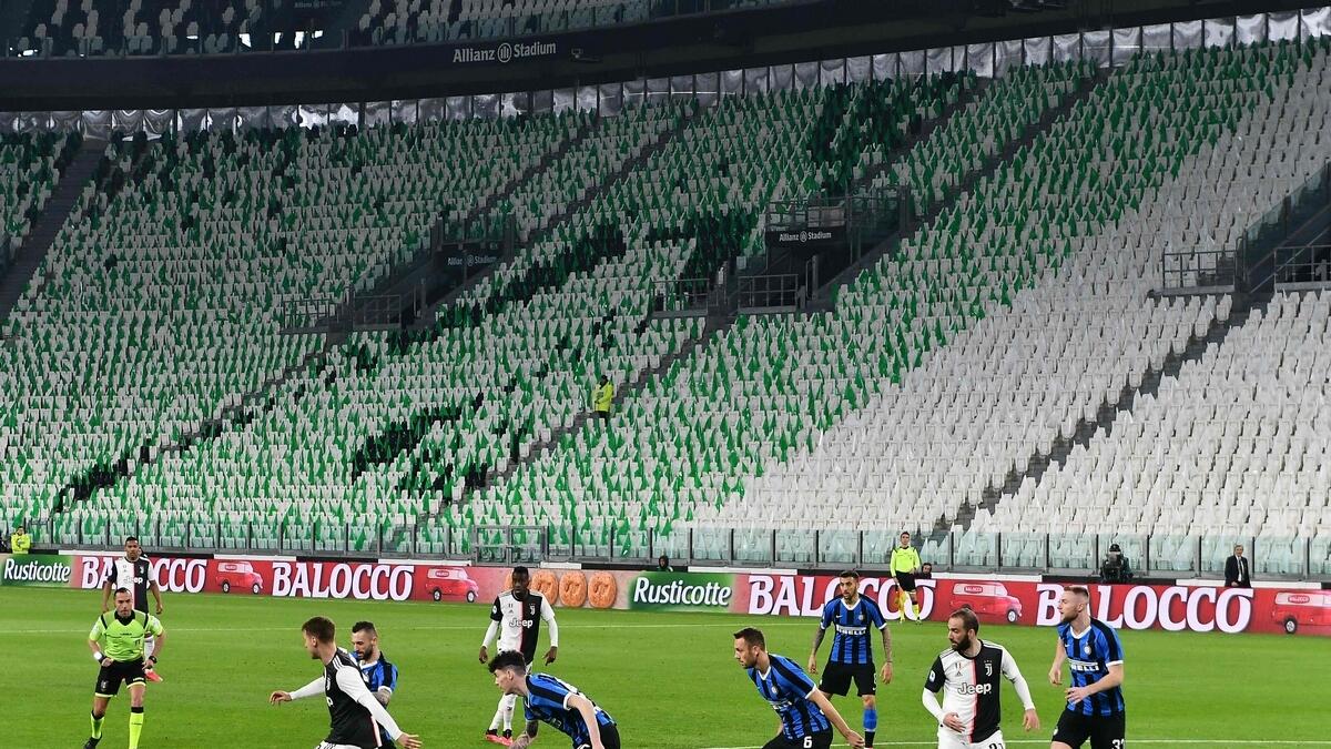 Inter Milan and Juventus players compete in an empty stadium in their Serie A game on Sunday due to the novel coronavirus outbreak. (AFP)