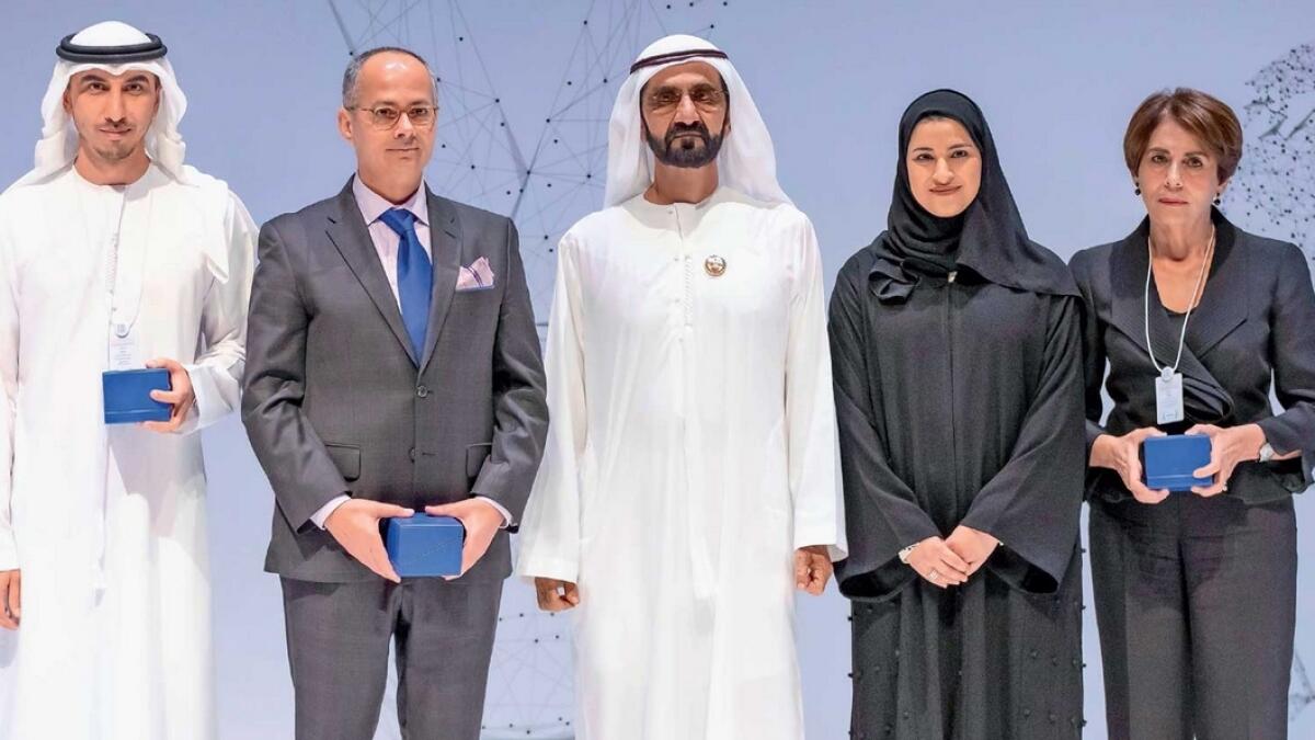 Sheikh Mohammed bin Rashid Al Maktoum with the winners of the MBR excellence awards. — Wam