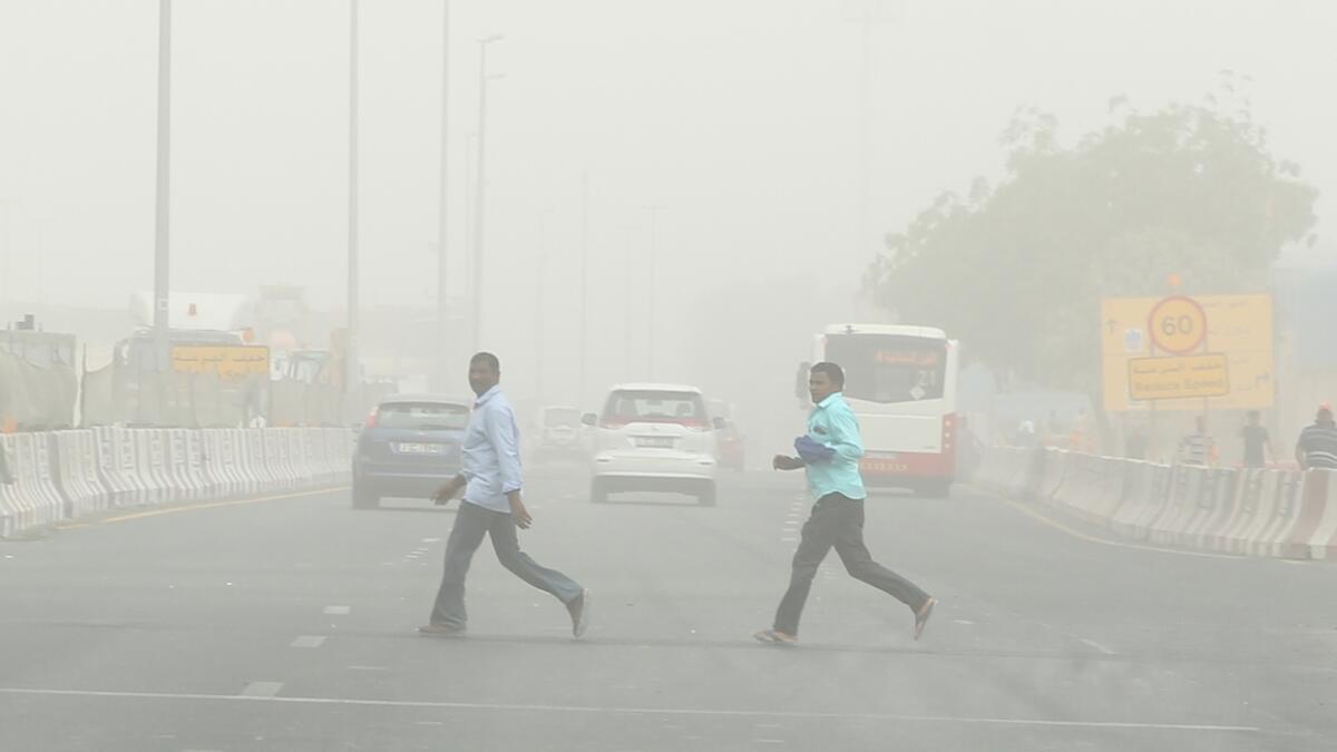 Dust storm, rain hits parts of Dubai, Al Ain Dubai.-Photo by Juidin Bernarrd/Khaleej Times
