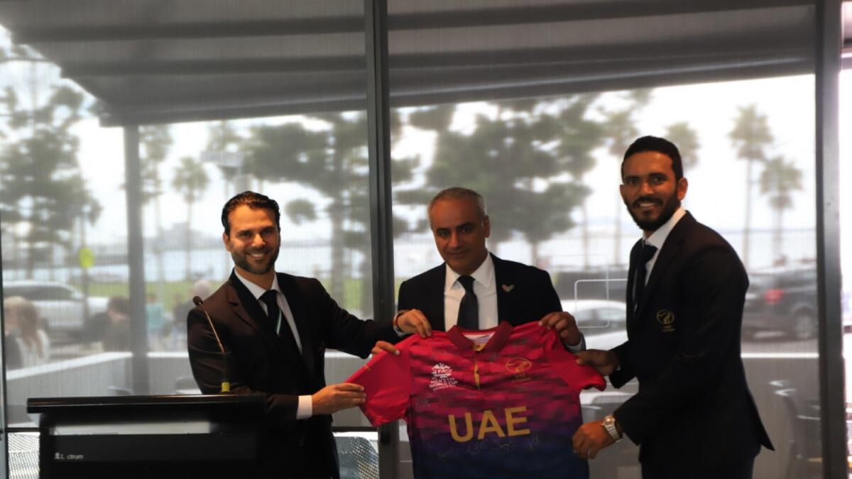 Abdulla Al Subousi (centre) receives a signed UAE team jersey from ECB member Zayed Abbas (left) and captain CP Rizwaan. — Supplied photo