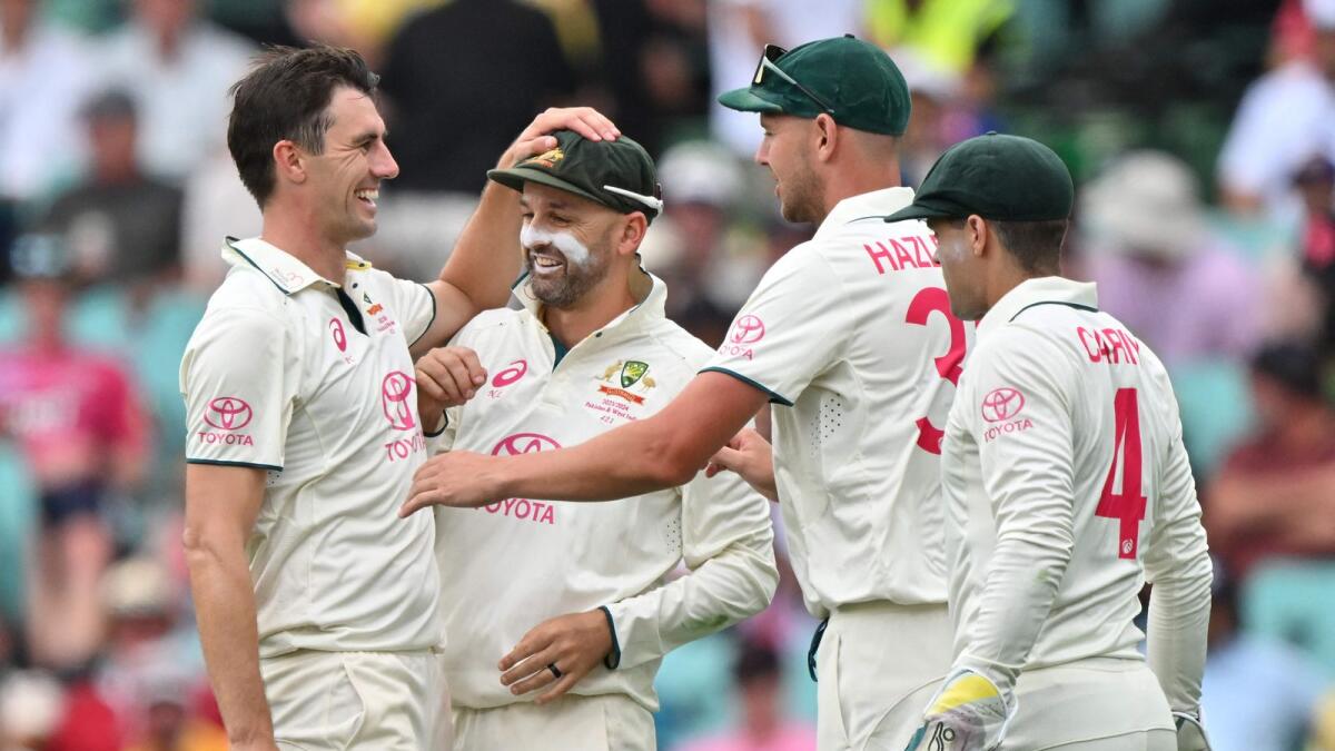 Australia’s Pat Cummins (L) celebrates the wicket of Pakistan’s Sajid Khan with teammates during the first day of the third cricket Test match against Australia at the Sydney Cricket Ground in Sydney on January 3, 2024. -- IMAGE RESTRICTED TO EDITORIAL USE - STRICTLY NO COMMERCIAL USE --(Photo by Saeed KHAN / AFP) / -- IMAGE RESTRICTED TO EDITORIAL USE - STRICTLY NO COMMERCIAL USE --