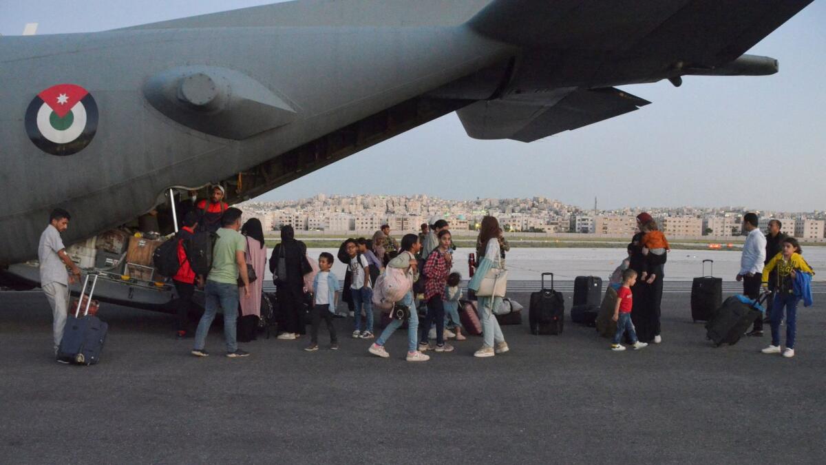Jordanian citizens and other nationals who were evacuated from Sudan, arrive at Marka Military Airport, in Amman. — Reuters
