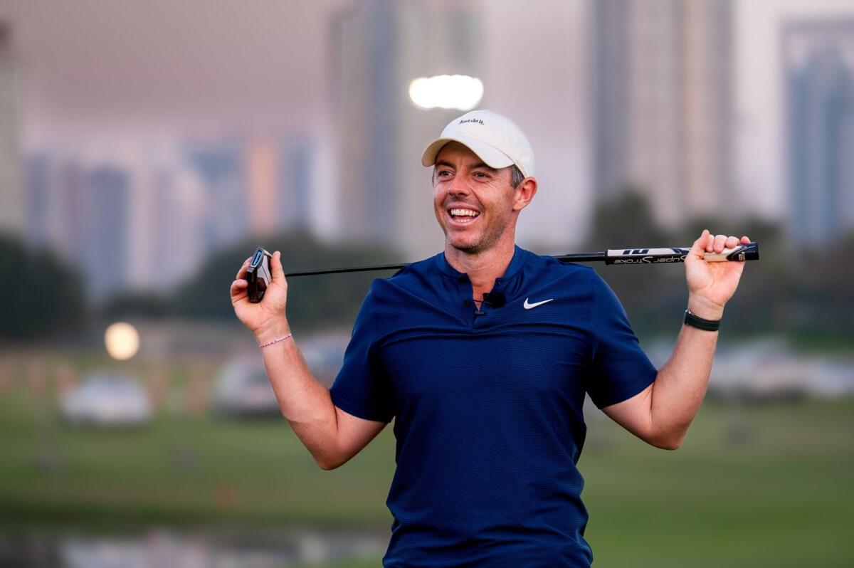 Rory McIlroy smiles while attending a clinic at the Emirates Golf Club in Dubai on Tuesday. — Photos by Shihab