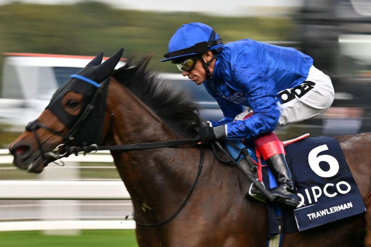 Italian jockey Frankie Dettori rides Trawlerman to win the British Champions Long Distance Stakes on Qipco British Champions Day at Ascot Racecourse,. - AFP