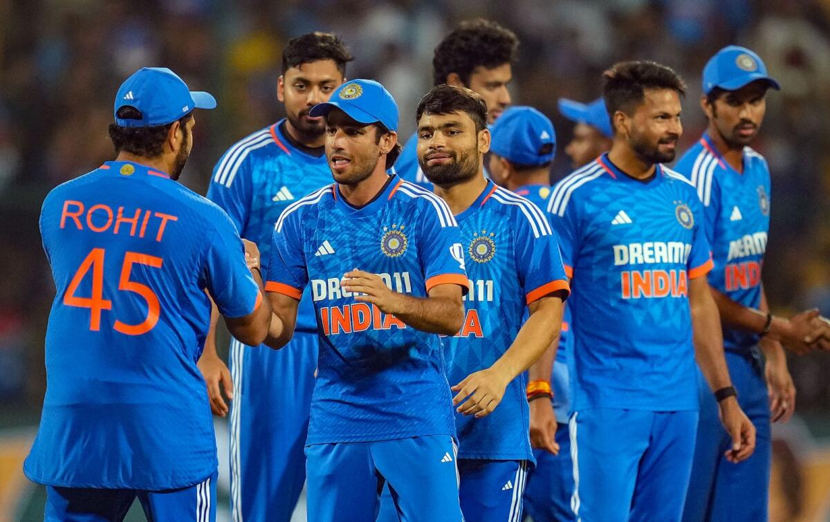 Indian players celebrate after the team won the third T20 match. — PTI