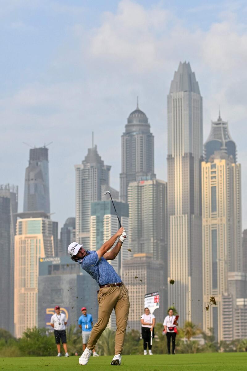 Cameron Young of USA plays his second shot on the 13th hole during the Hero Dubai Desert Classic on the Majlis Course at the Emirates Golf Club in Dubai on Friday. - AFP