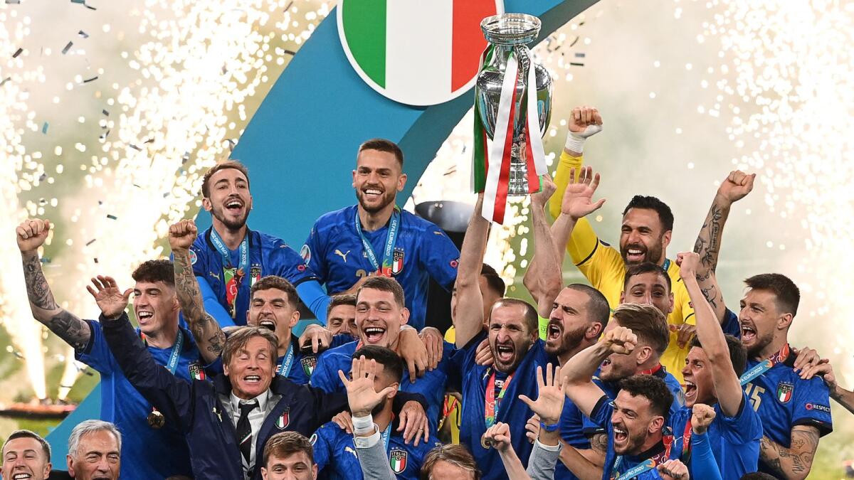 Italy players celebrate with the trophy after winning the Euro 2020 final against England. (AFP)