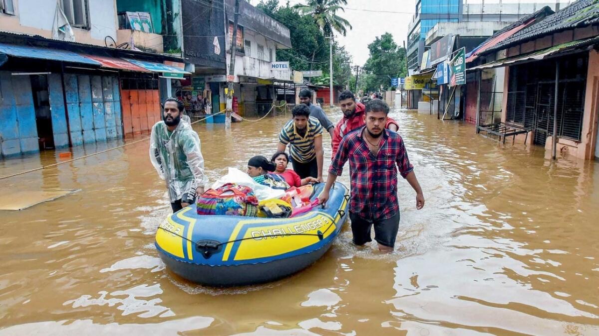 People are being rescued from flood-affected areas in Kochi on Saturday. Efforts are continuing in the south Indian state to rescue thousands of stranded people. — PTI